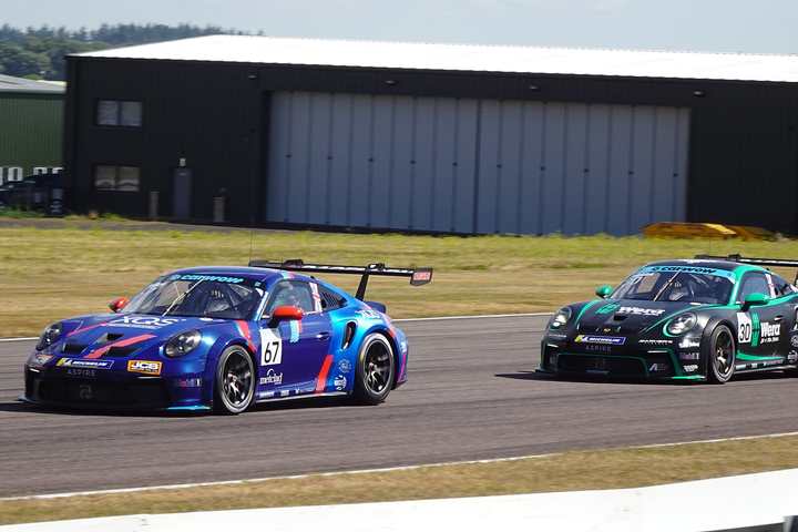 Two Porsche 911 Cup cars racing at Thruxton in the 2026 Porsche Carrera Cup Great Britain