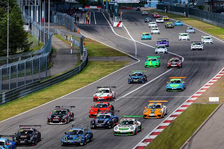 The start of a Porsche Sprint Challenge race at the Nürburgring with a full grid of 911 Cup cars