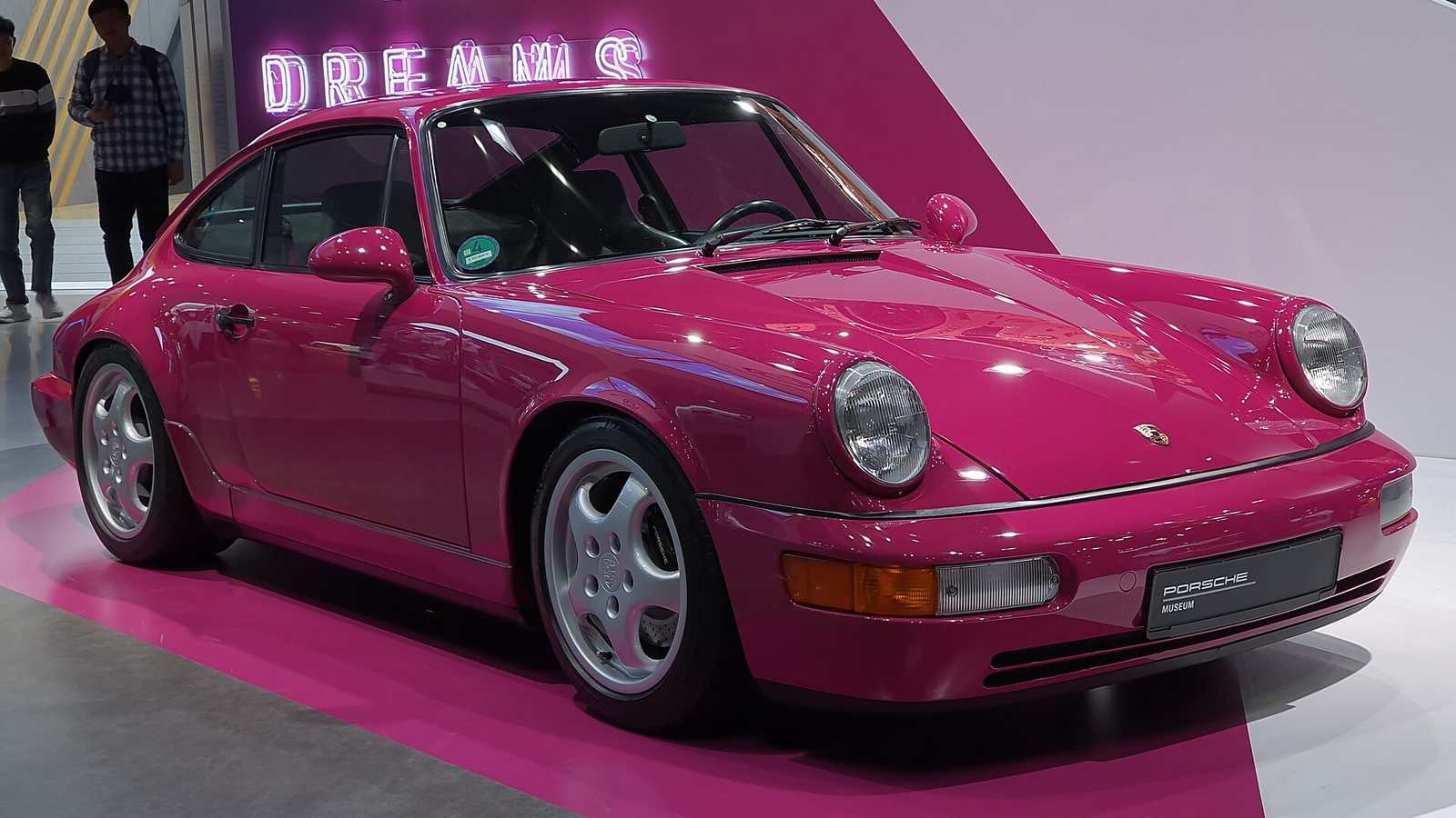A Porsche 911 Carrera RS of the 964 generation in Rubystone Red on display