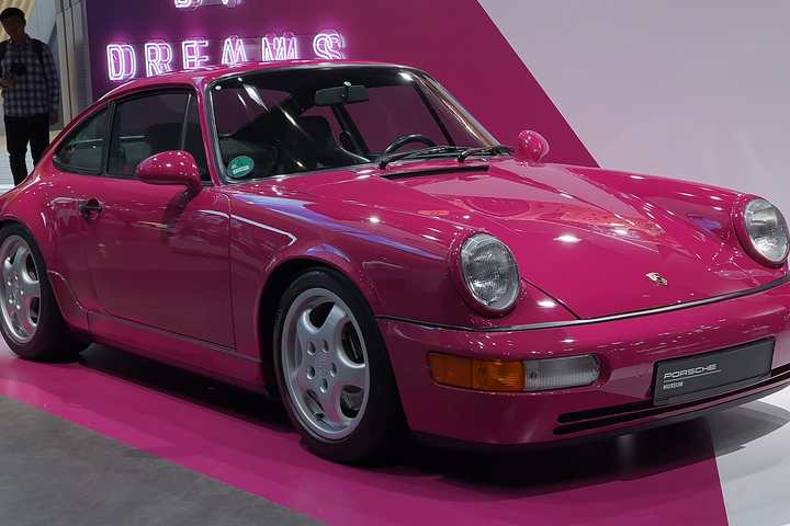 A Porsche 911 Carrera RS of the 964 generation in Rubystone Red on display