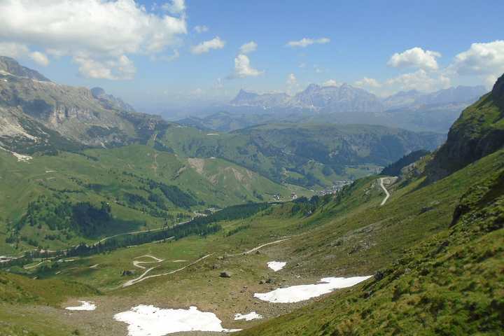 The Great Dolomites Road between Arabba and the Pordoi Pass with Dolomite peaks beyond