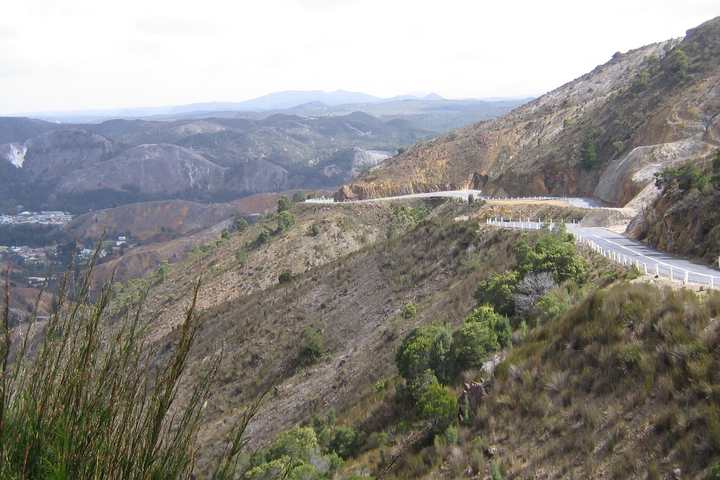The Lyell Highway descending bare hills towards Queenstown, Tasmania
