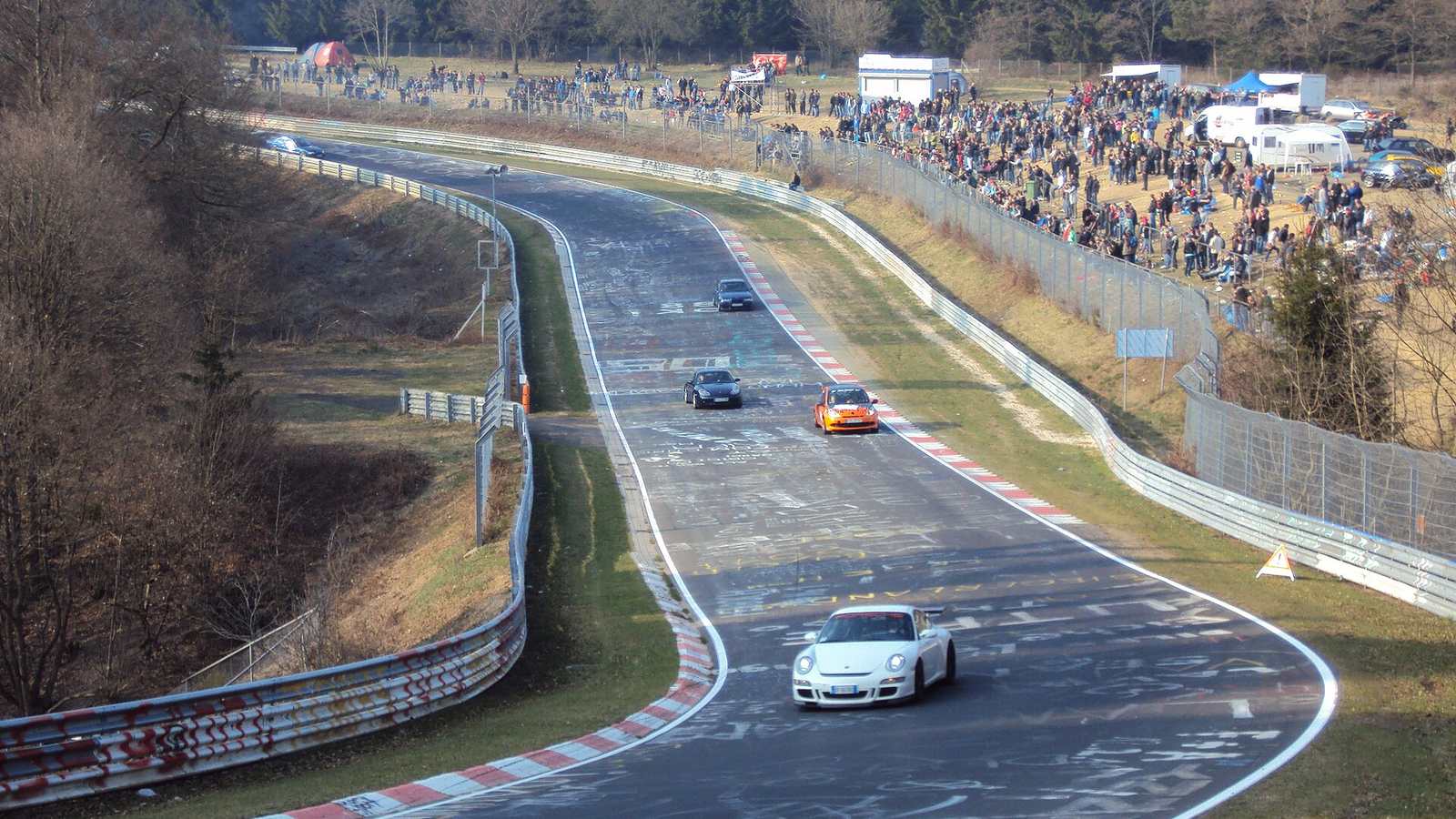 Cars lapping the Nürburgring Nordschleife at Brünnchen during a public session