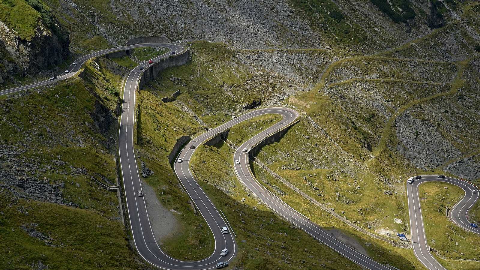 The Transfăgărășan road looping across the upper Bâlea valley in Romania